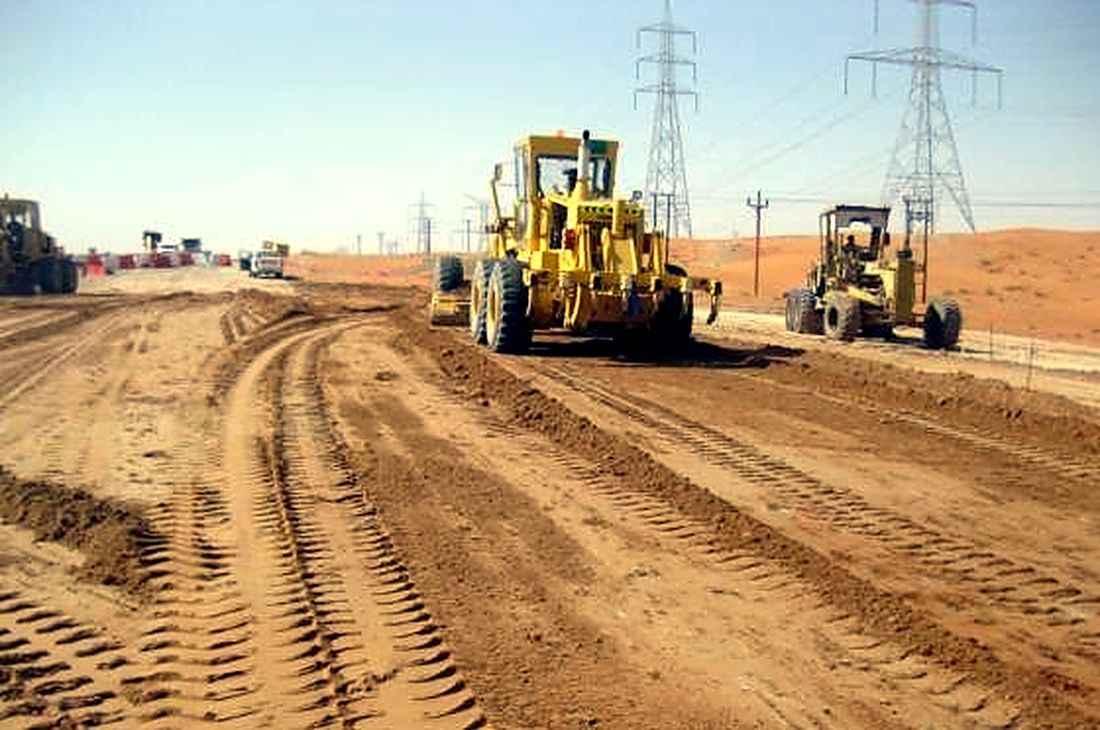 Motor graders on a road earthworks site in Oman